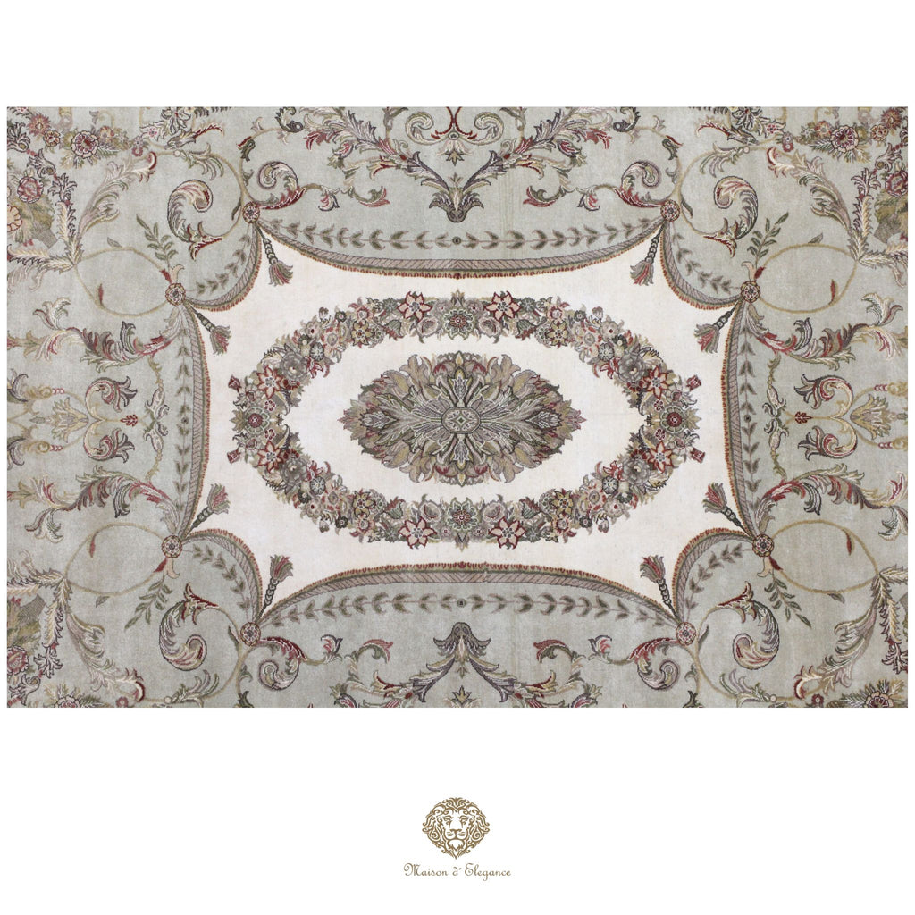 Decorative patterned rug with intricate designs on a green background