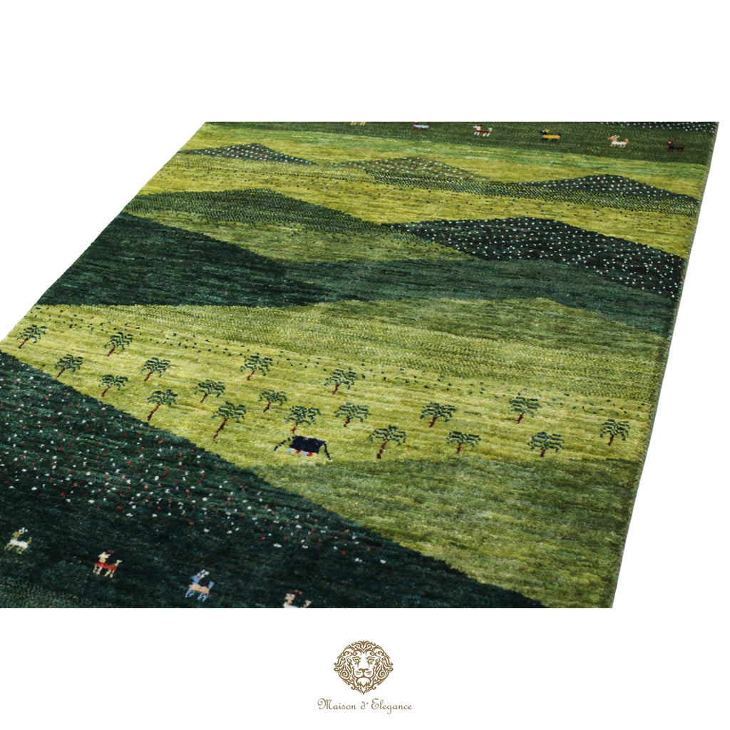 Green patterned rug with a landscape design featuring trees and animals.