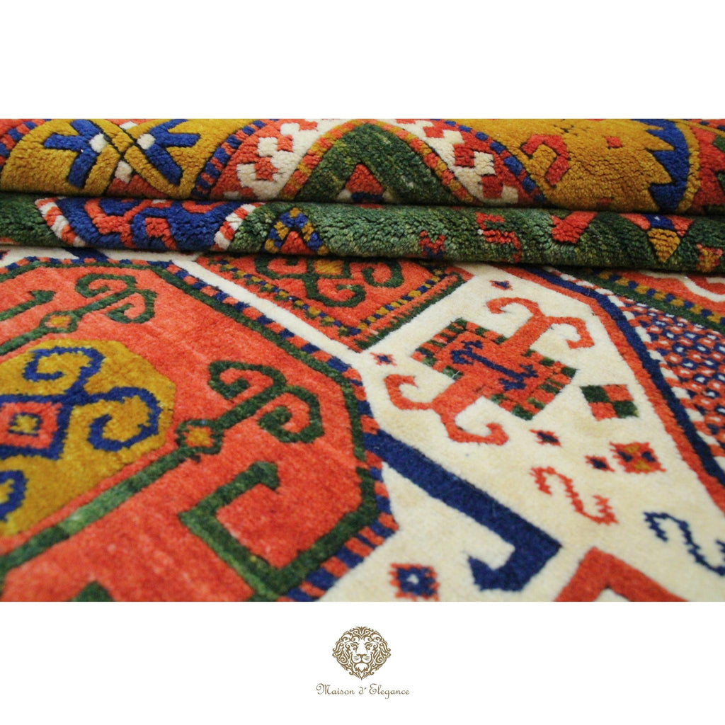 Colorful patterned fabric with geometric designs on a Green background