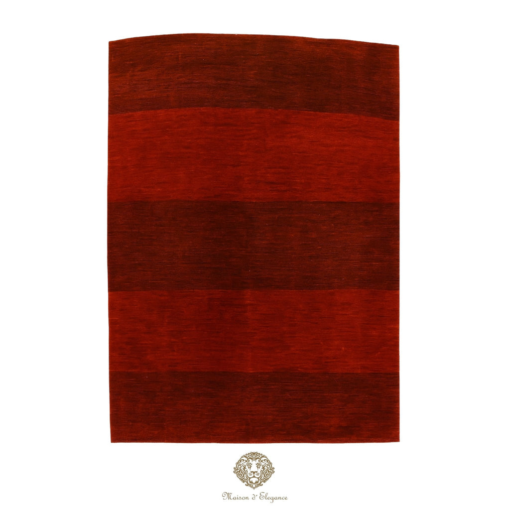 Red striped rug on a red background with a brand logo at the bottom.