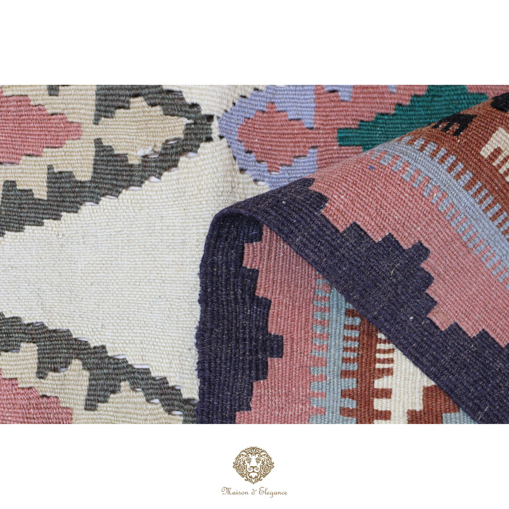 Close-up of a patterned rug with geometric design on a white background