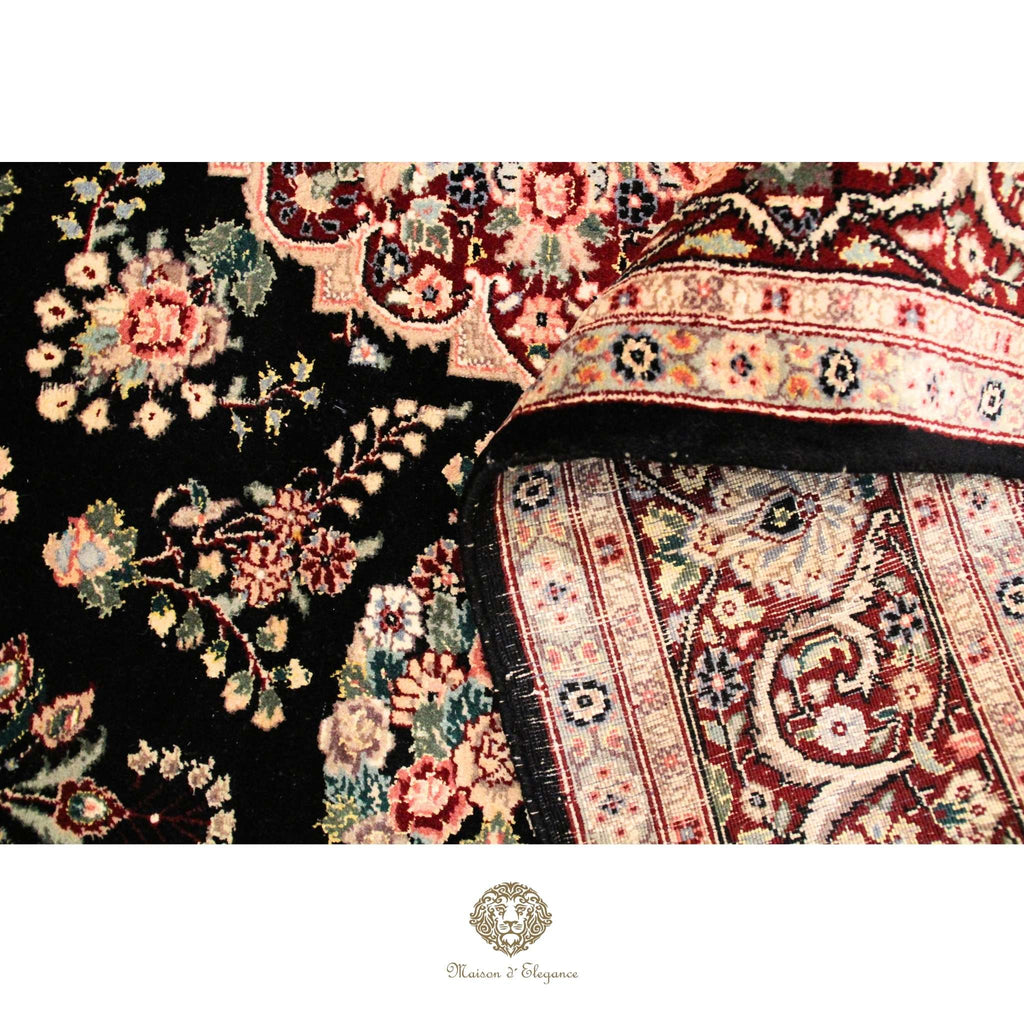 Close-up of a patterned rug with intricate designs on a Brown background