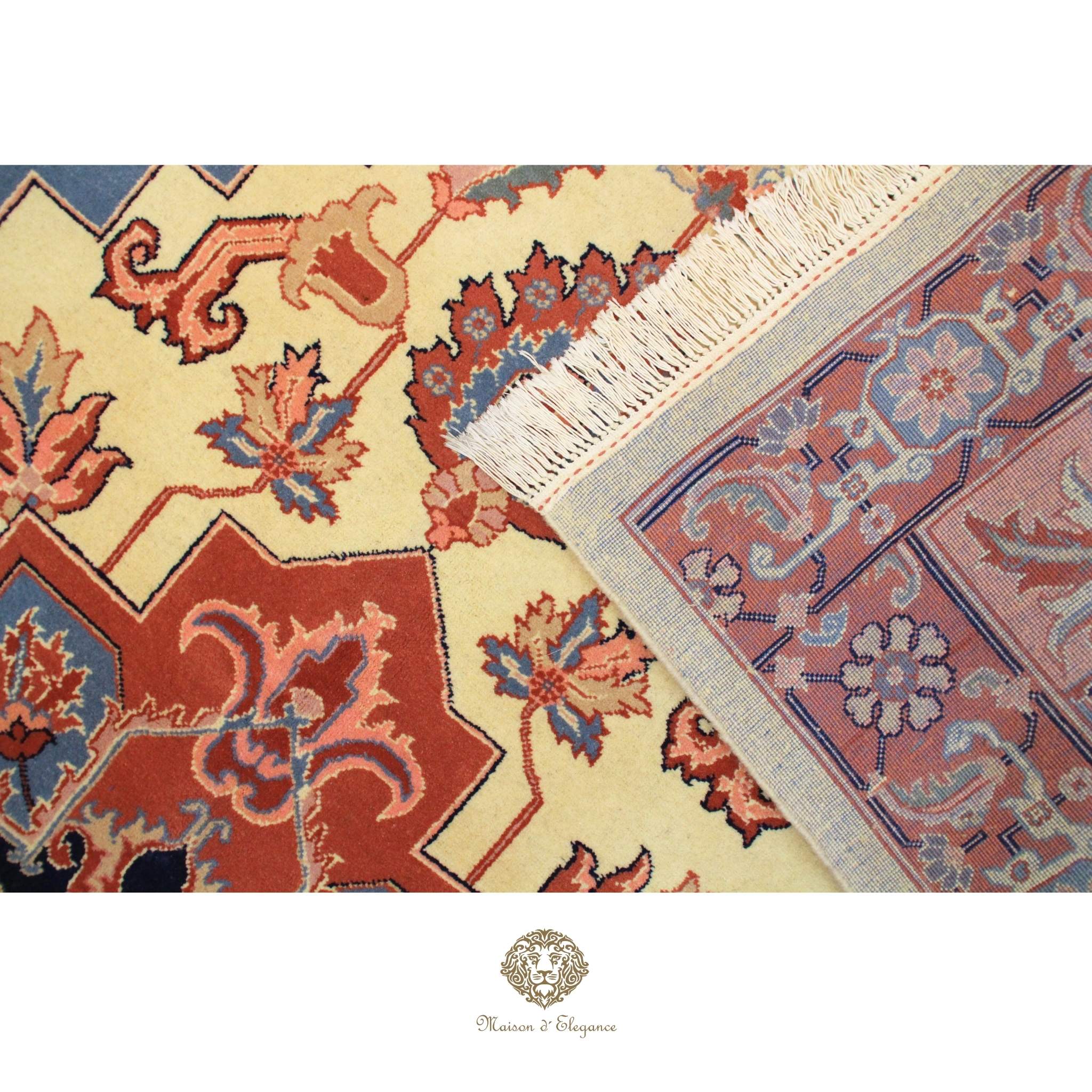 Close-up of a patterned rug with intricate designs on a Ivory background.