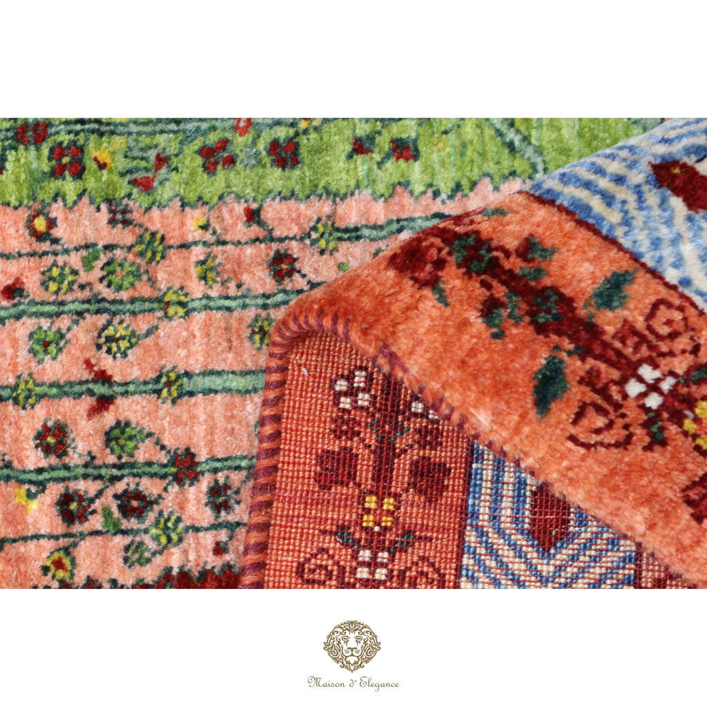 Close-up of a patterned rug with visible brand logo.