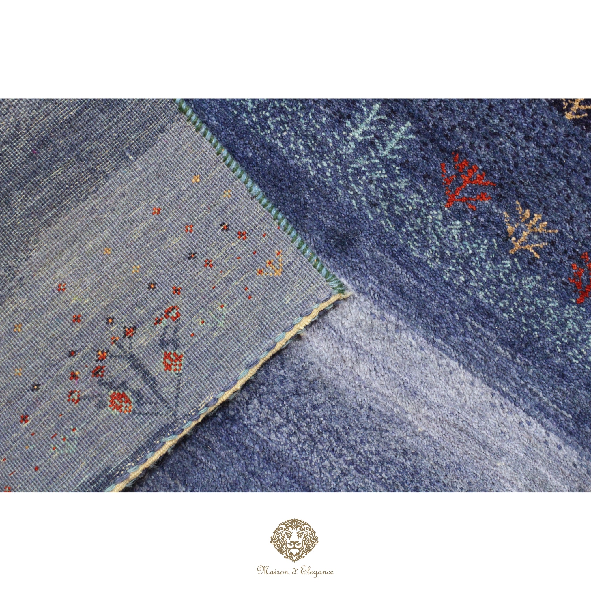 Close-up of a textured blue fabric with floral patterns on a white background.