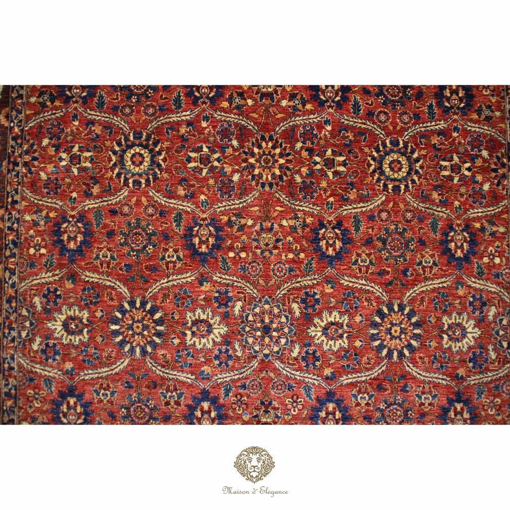 Decorative rug with intricate patterns on a red background