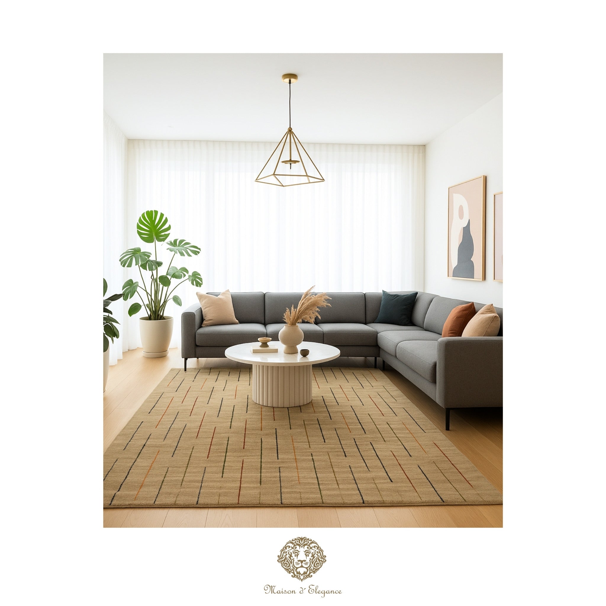 Modern living room with a gray sectional sofa, round coffee table, and decorative elements.
