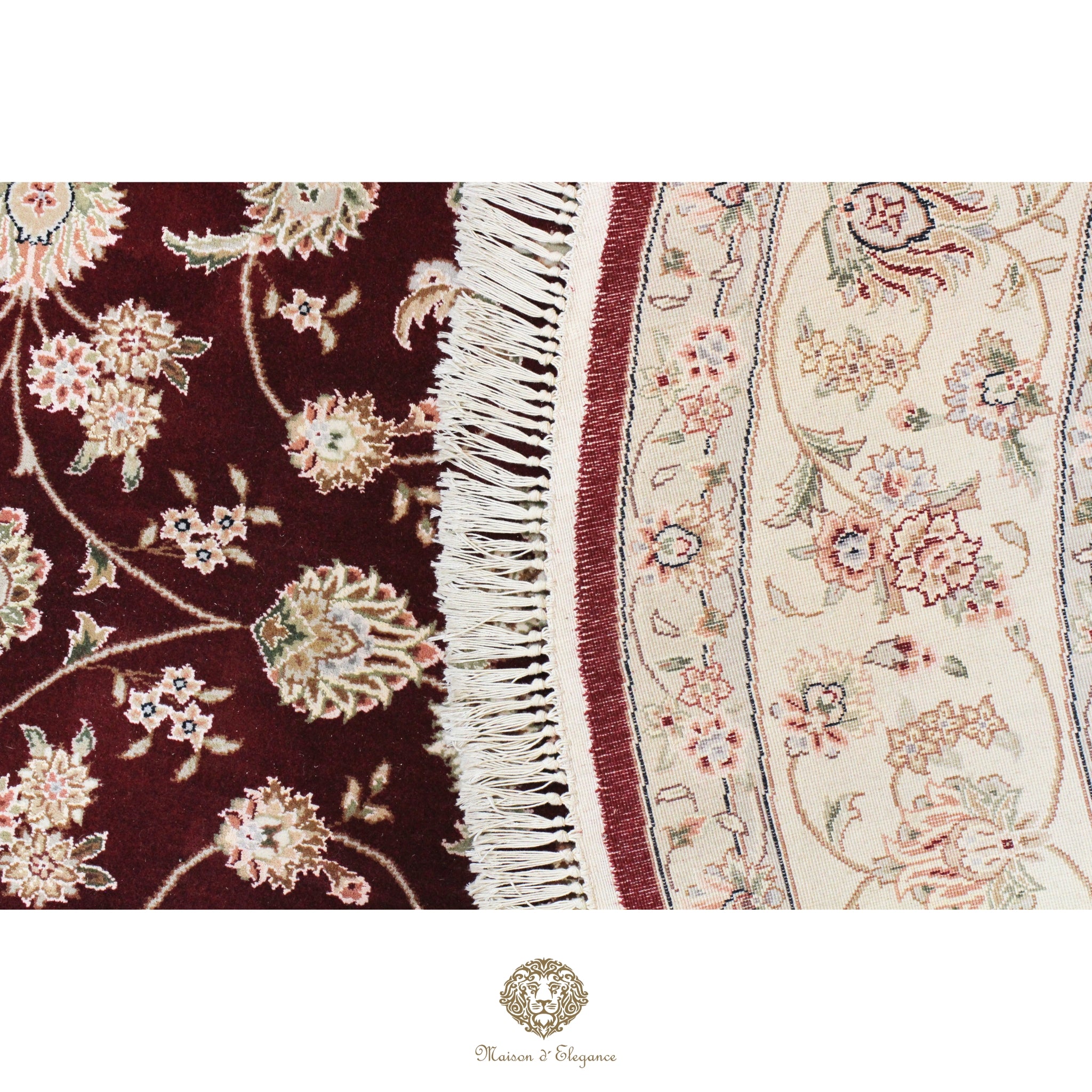 Close-up of a floral-patterned rug with a visible brand logo.