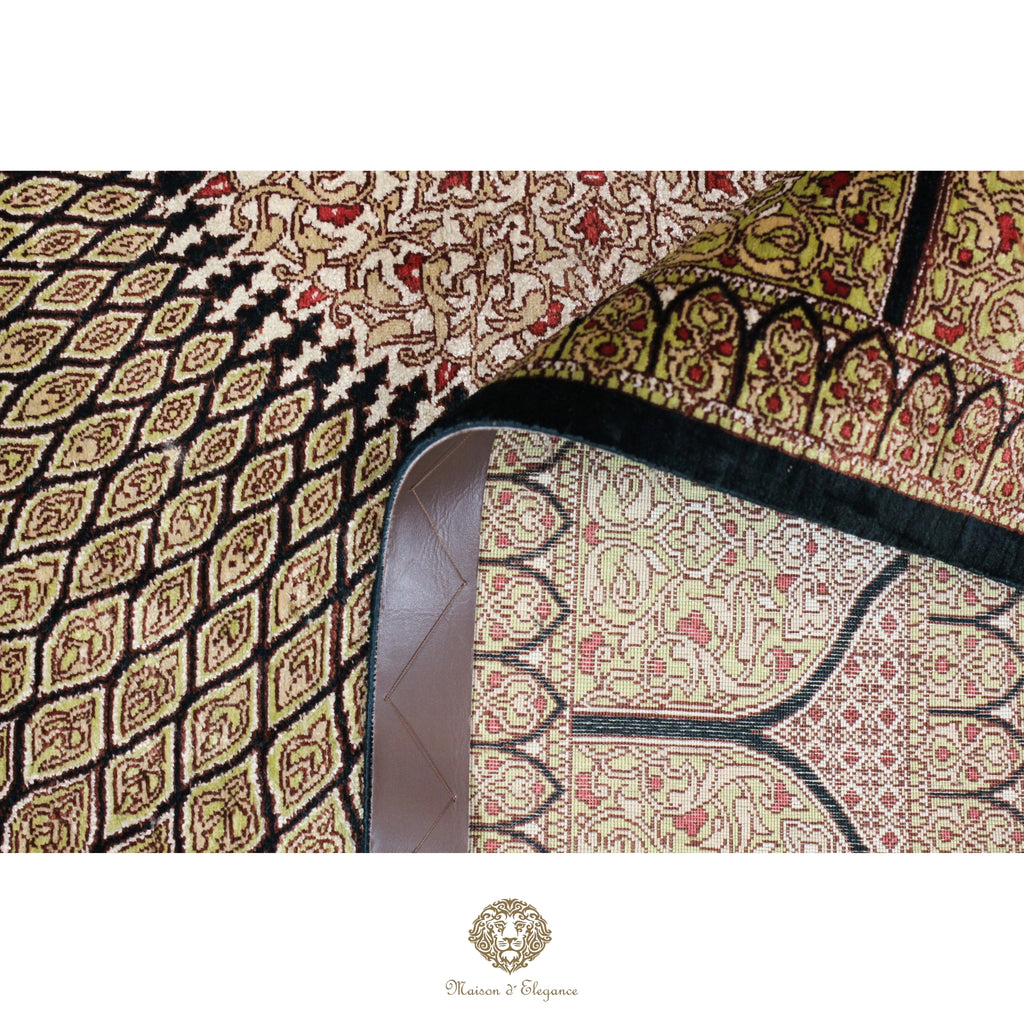 Close-up of a patterned fabric with intricate designs on a white background
