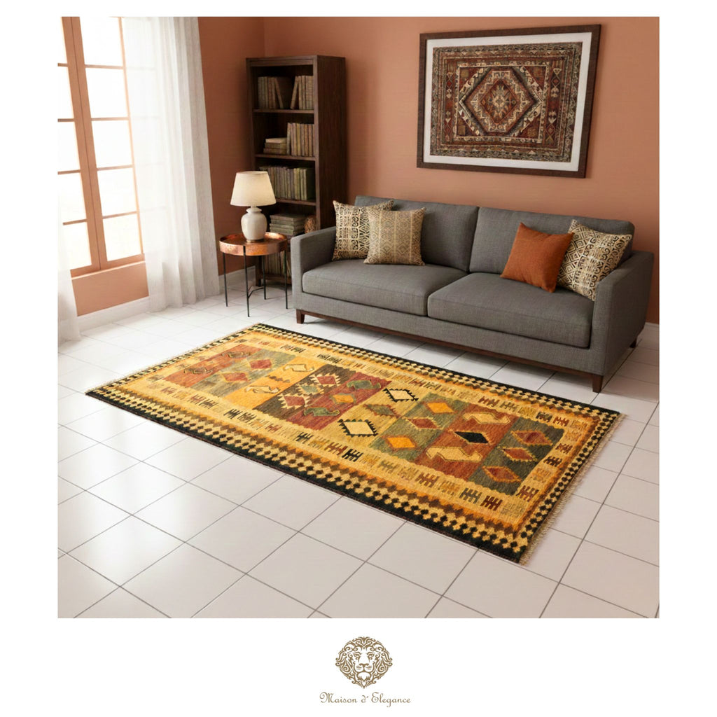 Living room with a patterned rug, gray sofa, and decorative wall art.