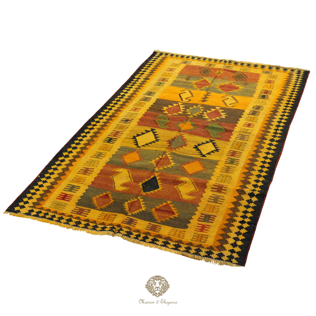 Traditional patterned rug with geometric design on a white background