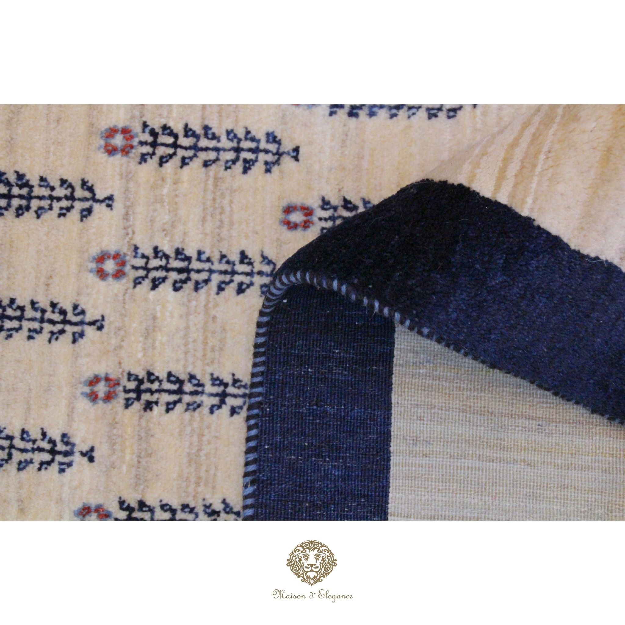 Close-up of a textured fabric with blue and red patterns on a beige background, featuring the brand 'Rug & Design' at the bottom.