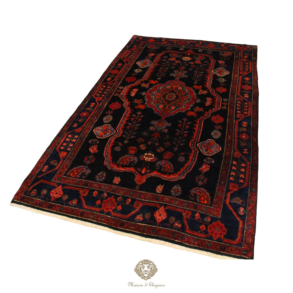 Decorative rug with intricate patterns on a navy background