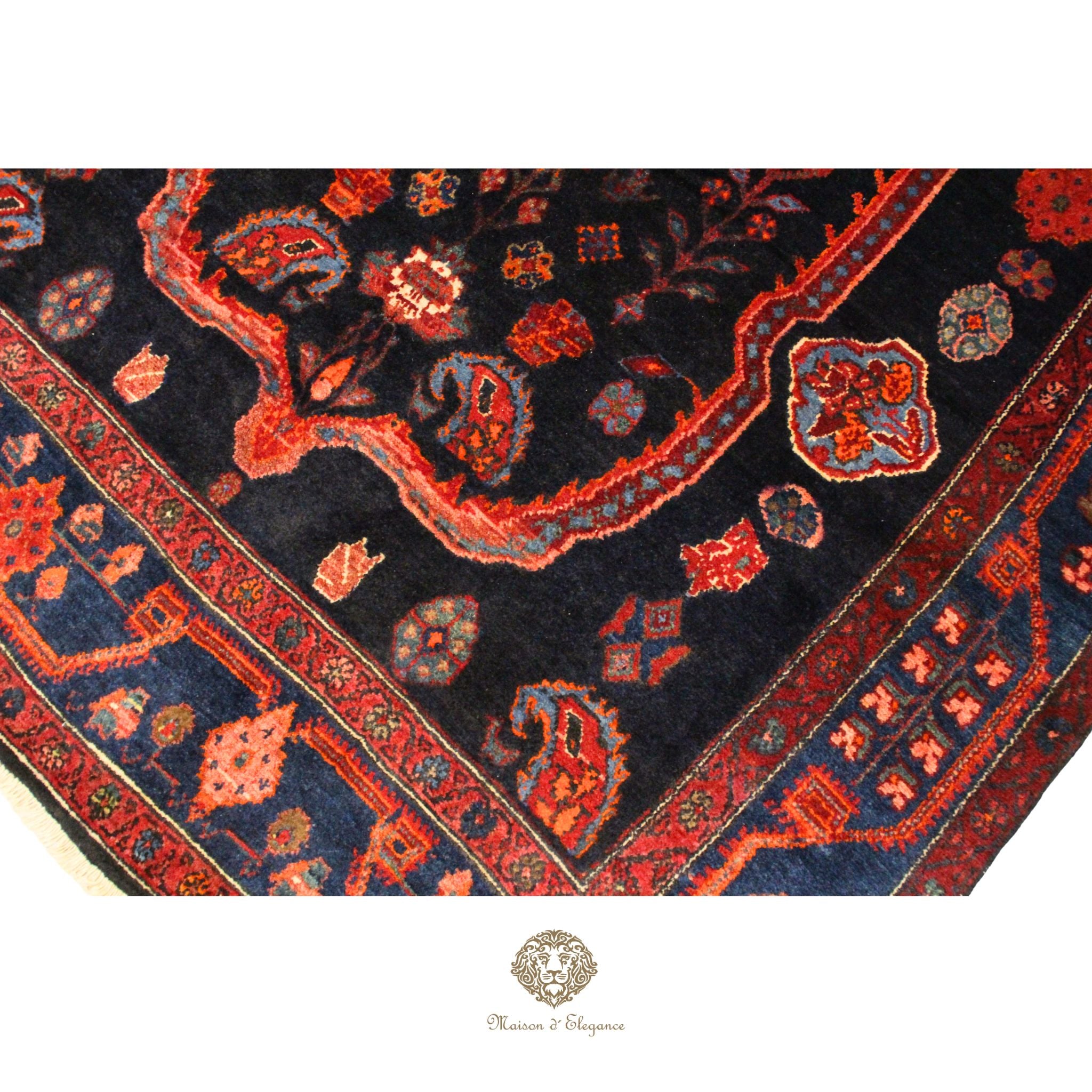 Close-up of a patterned rug with intricate designs on a navy background