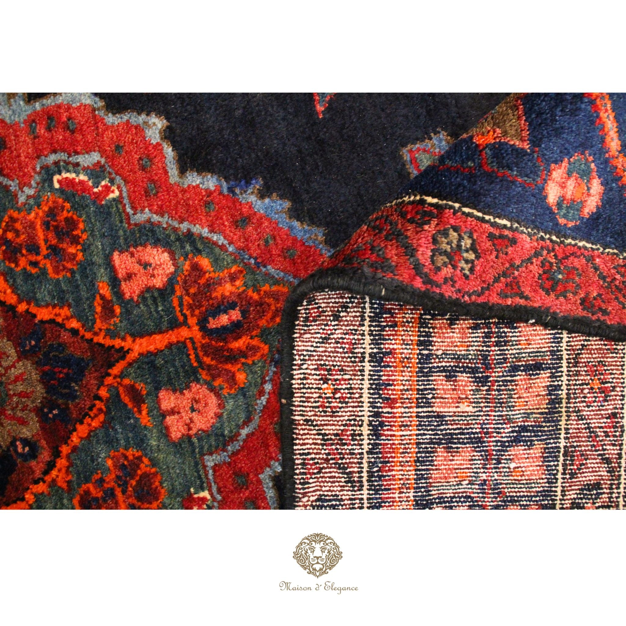 Close-up of a patterned rug with intricate designs on a navy background