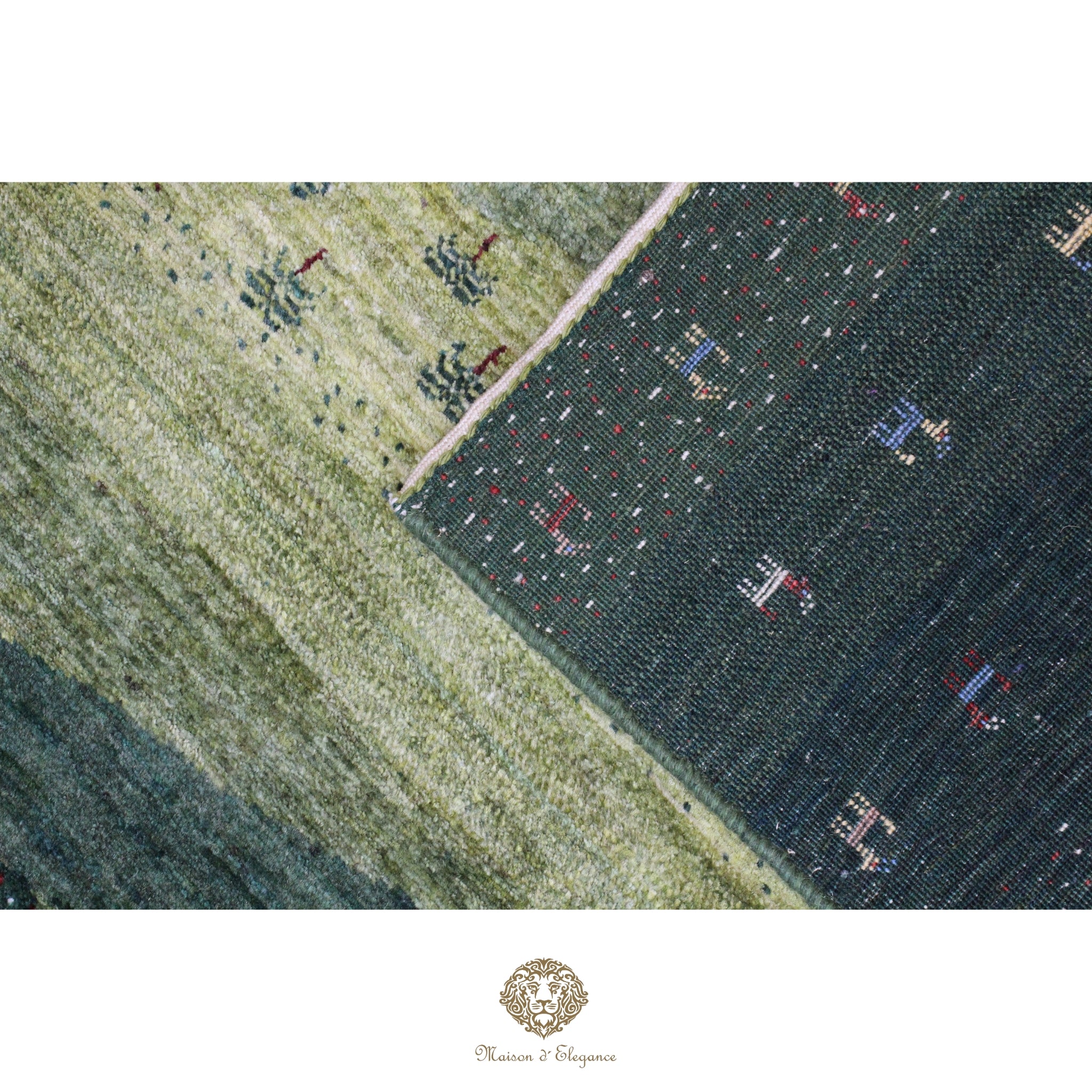 Close-up of a patterned rug with geometric designs on a green background
