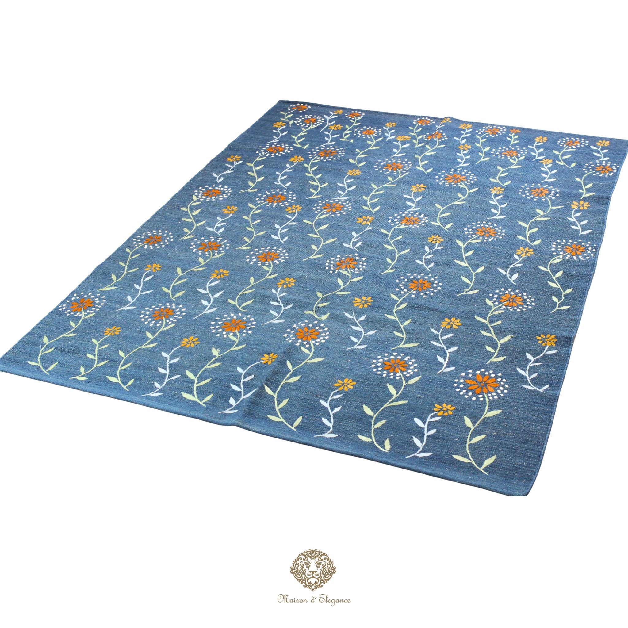 Blue floral patterned rug on a white background
