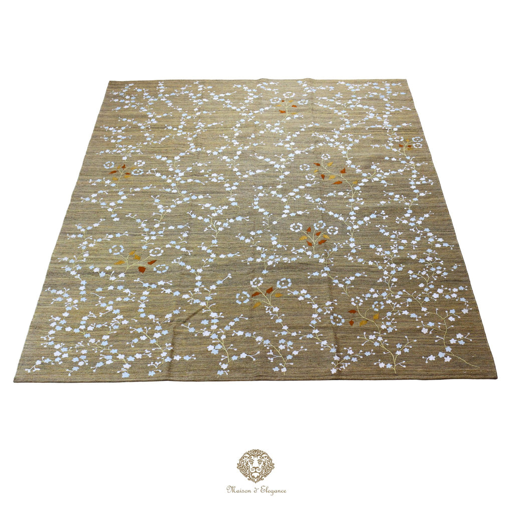 Beige rug with white floral pattern on a beige background