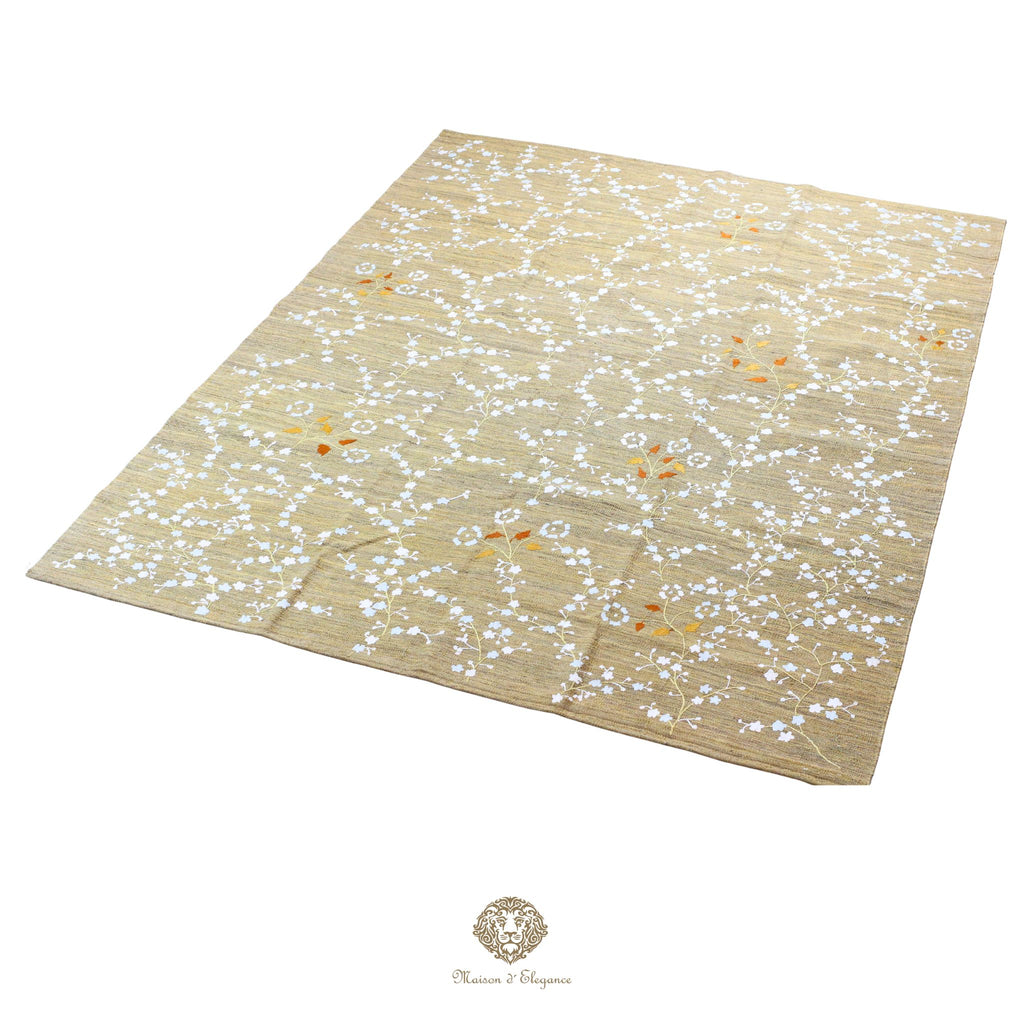Beige woven placemat with white floral pattern on a wbeige background