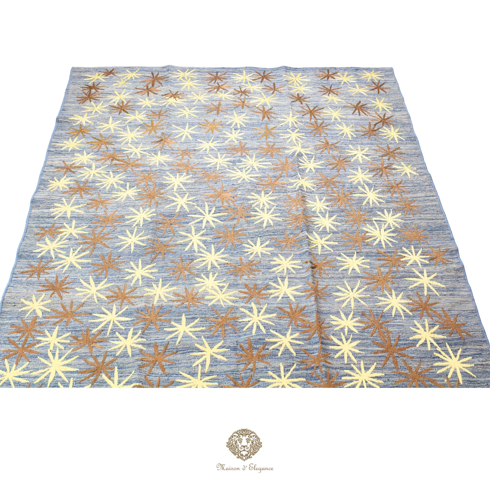 Patterned fabric with star-like shapes on a blue background