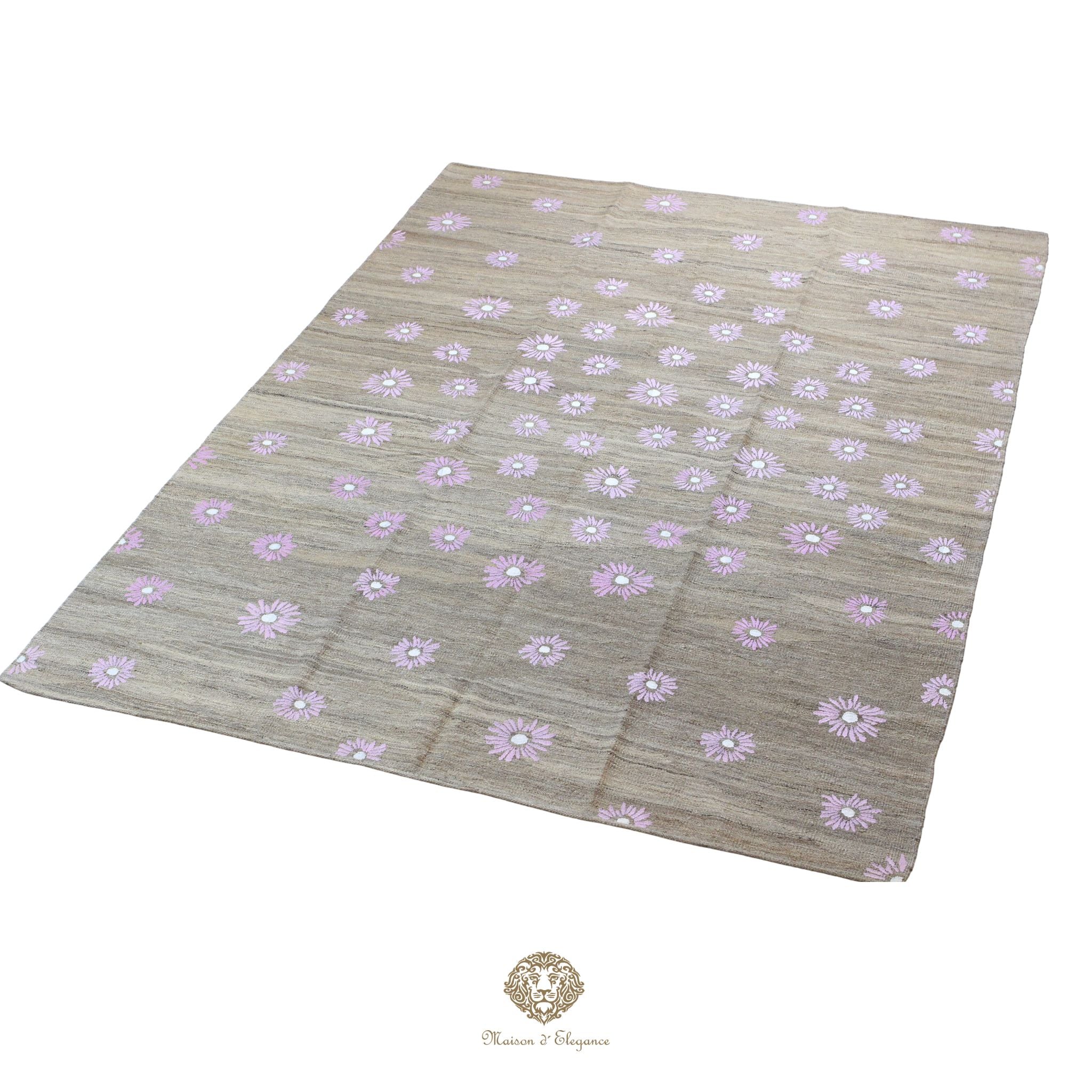 Beige fabric with purple floral pattern on a white background