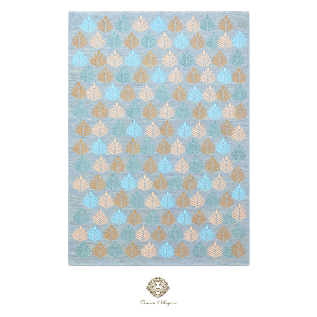 Patterned rug with geometric design on a light blue background