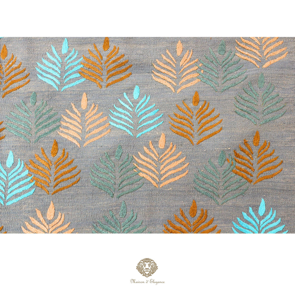Patterned fabric with leaf design on a gray background