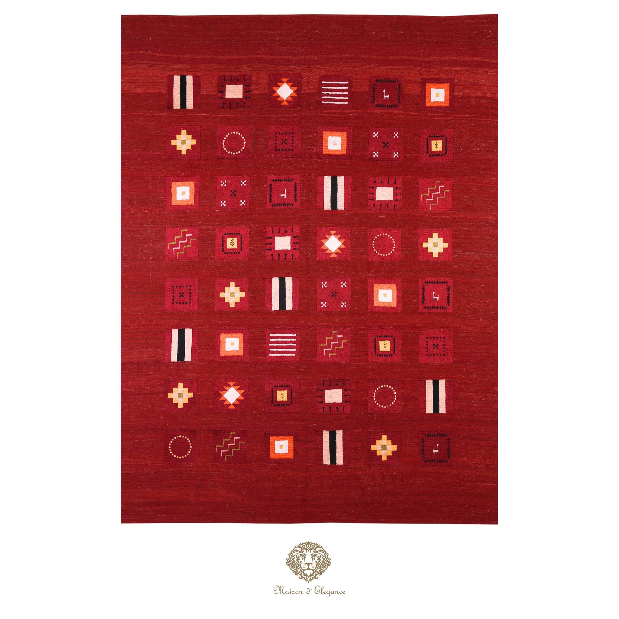 Red patterned rug with geometric designs on a red background