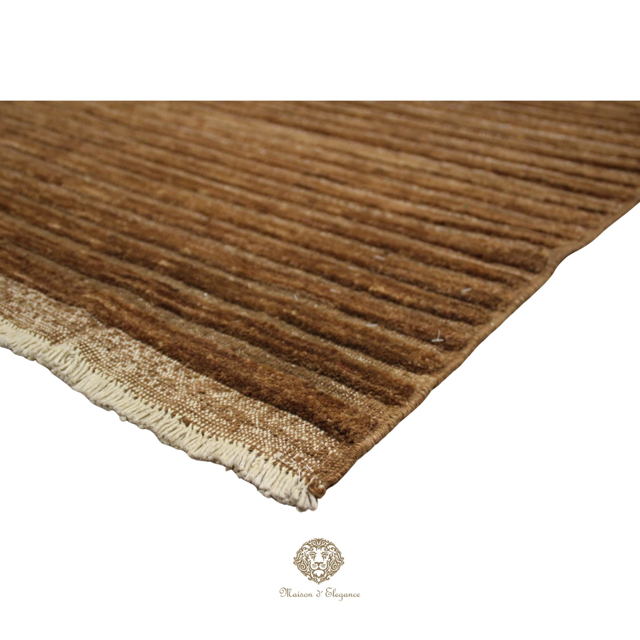 Brown textured rug with a visible brand logo in the corner.