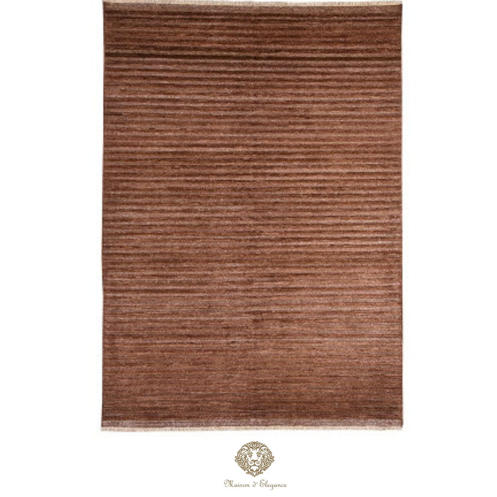 Brown rug with a subtle pattern on a brown background