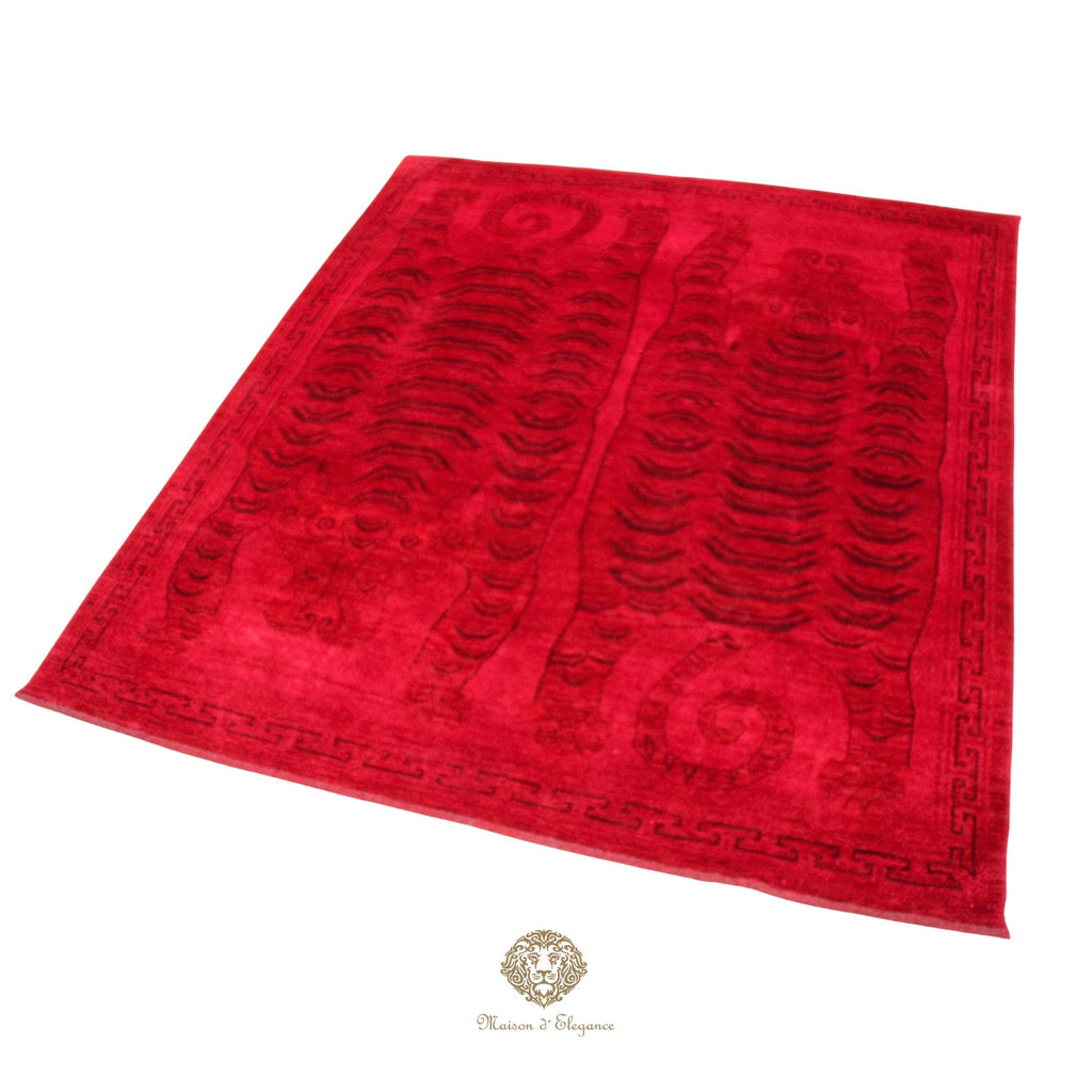 Red rug with black patterns on a red background