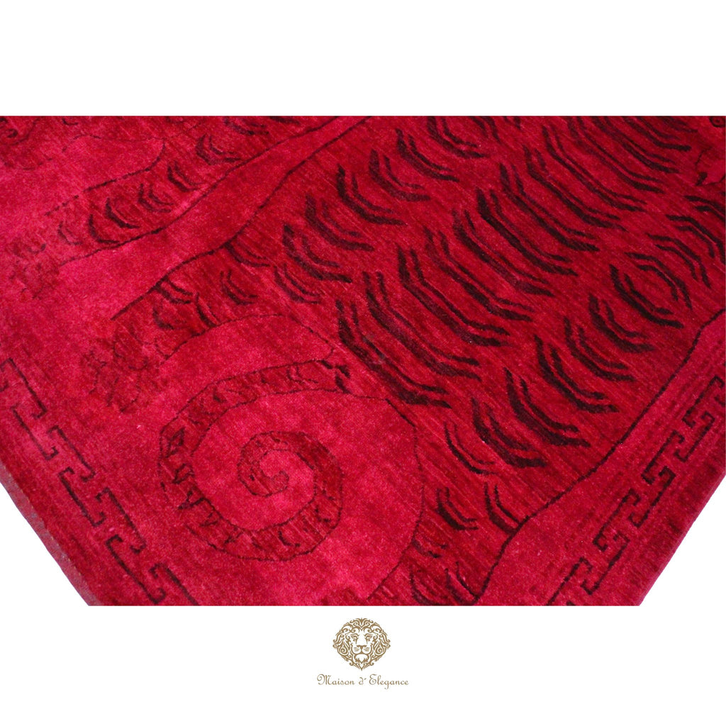 Red textured fabric with intricate patterns on a red background