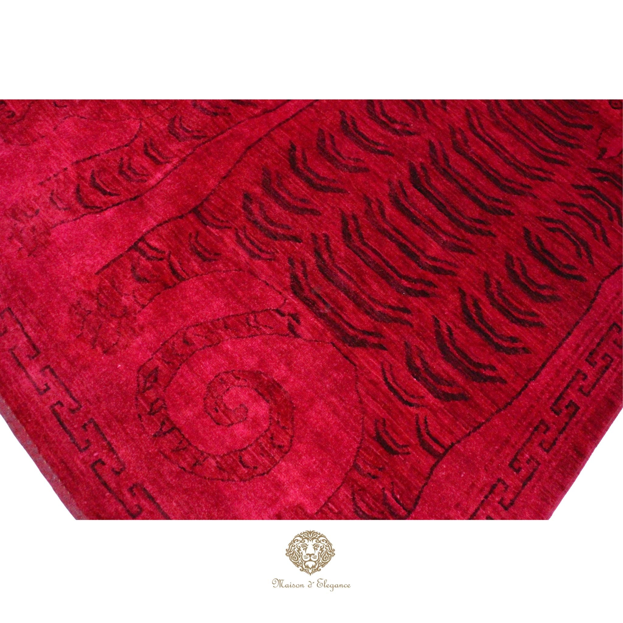 Red textured fabric with intricate patterns on a red background
