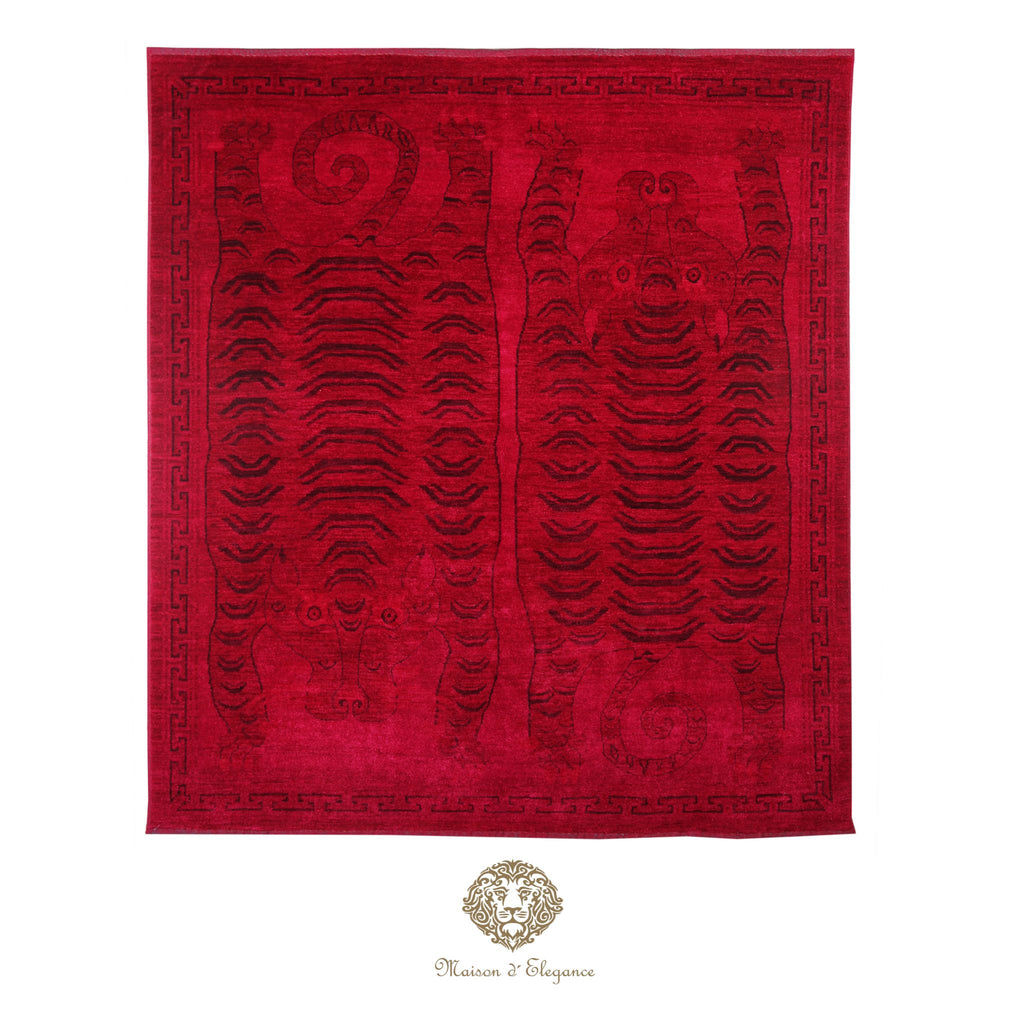Red fabric with elephant design and Maison d'Elephant logo on a red background