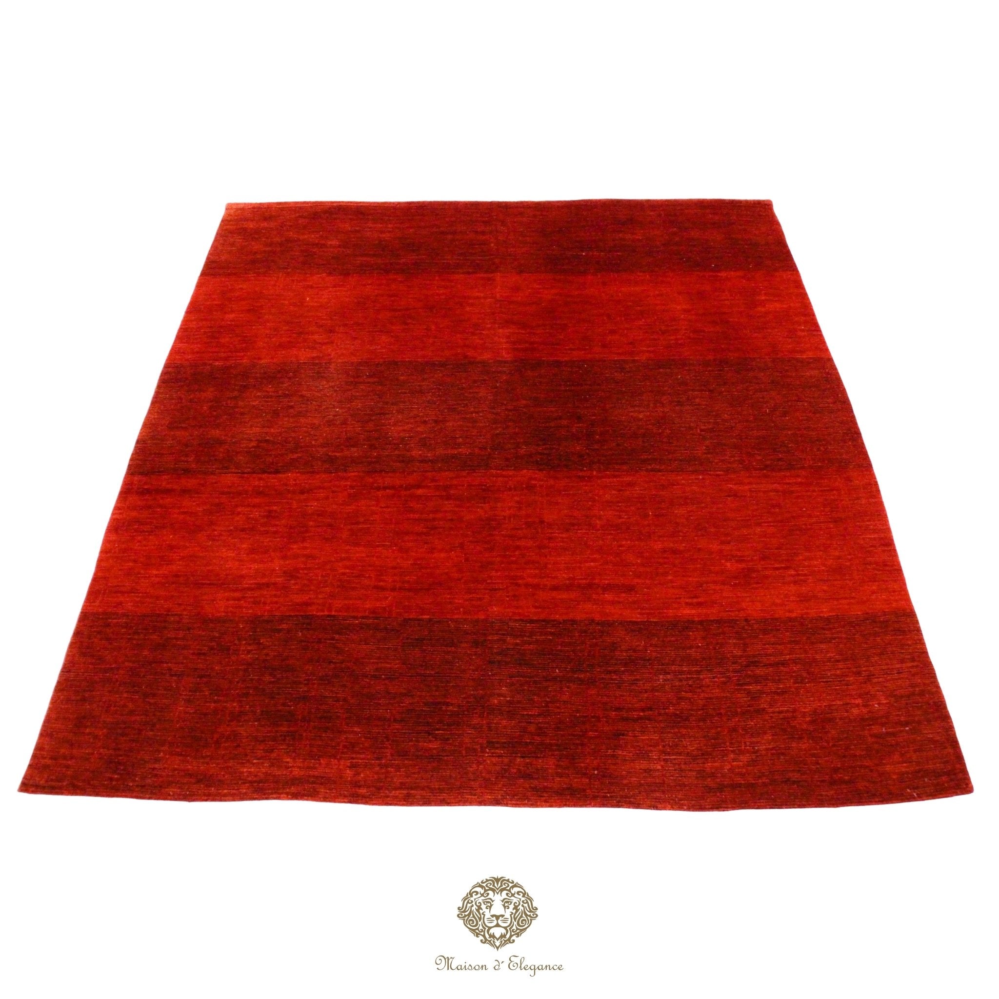 Red rug with a textured pattern on a red background