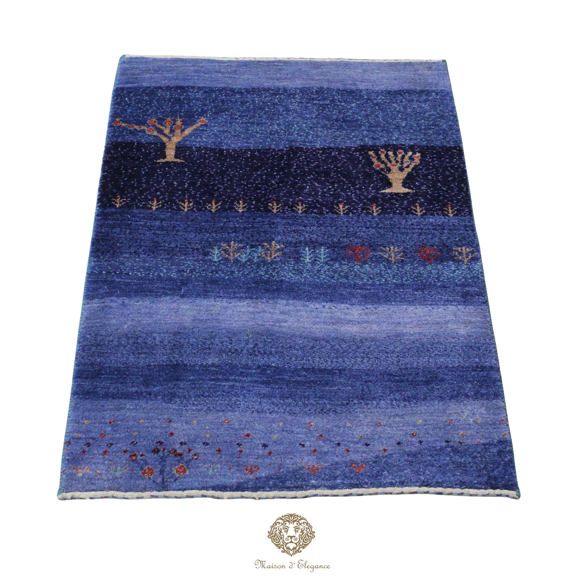 Blue patterned rug with decorative elements on a white background