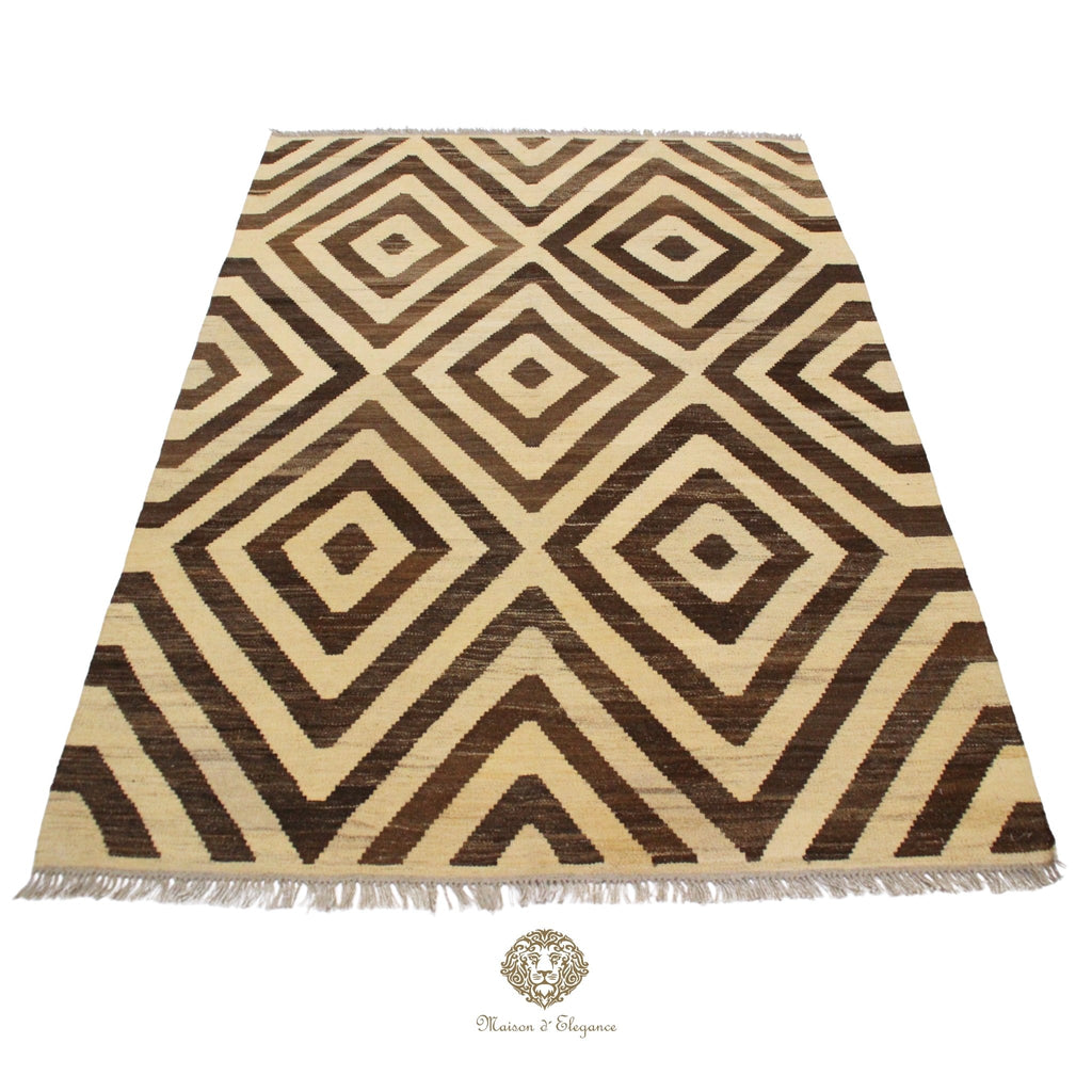 Rug with brown and beige geometric pattern on a Ivory background