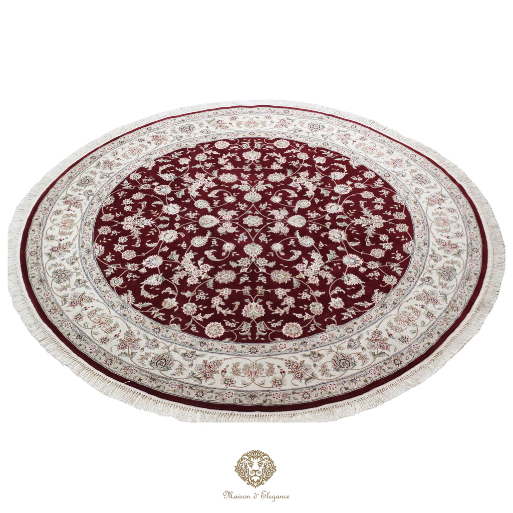 Round red and white patterned rug on a red background