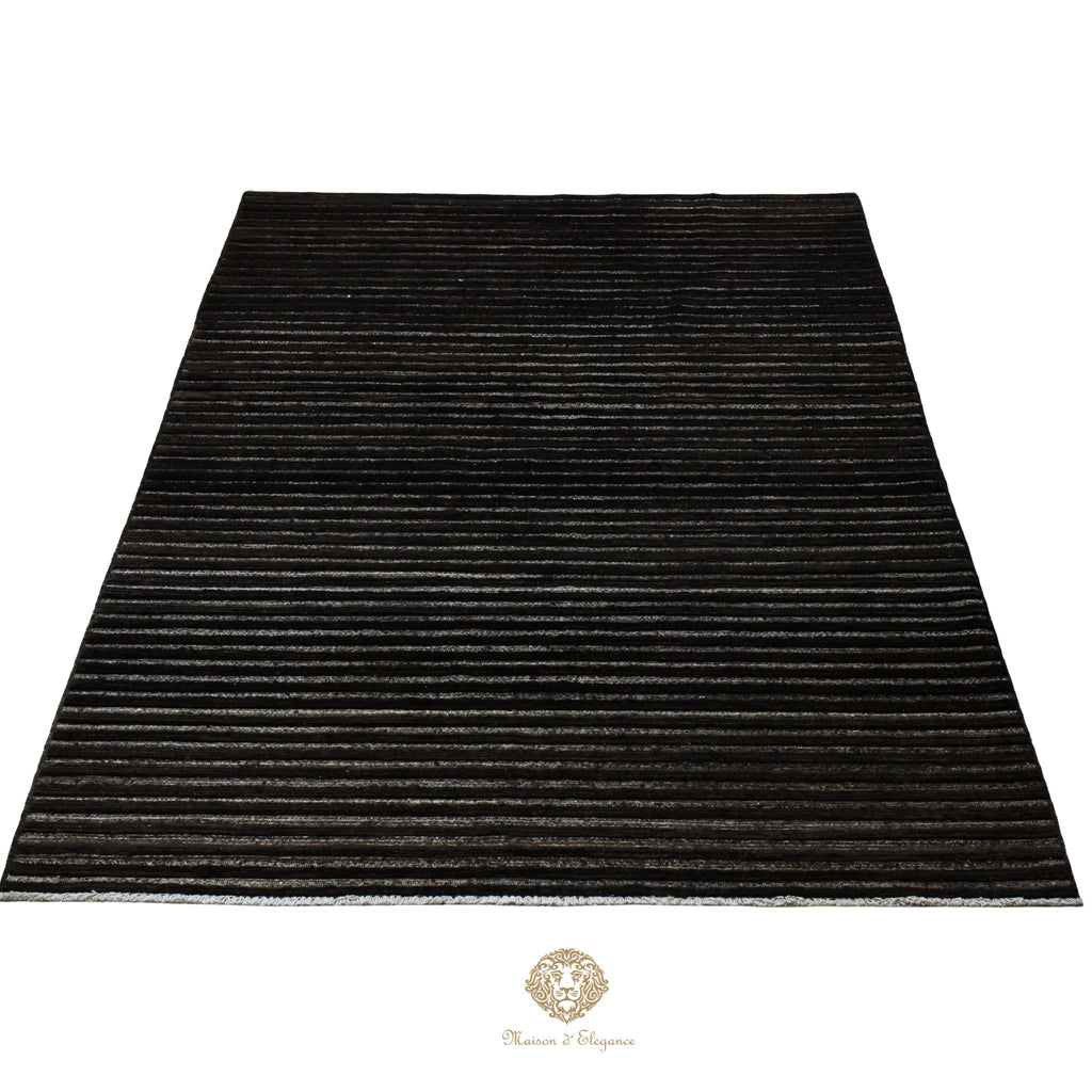 Black rug with striped pattern on a white background