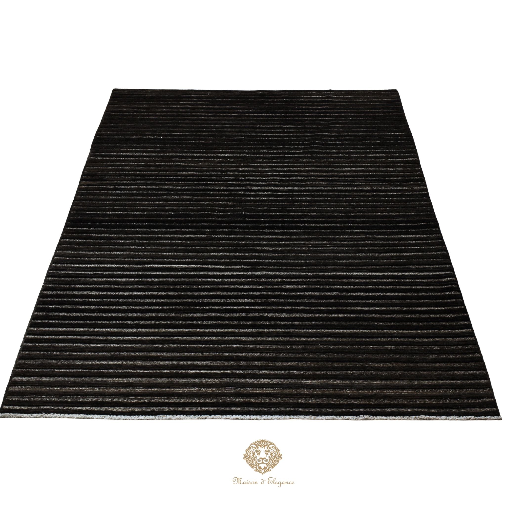 Black rug with striped pattern on a white background