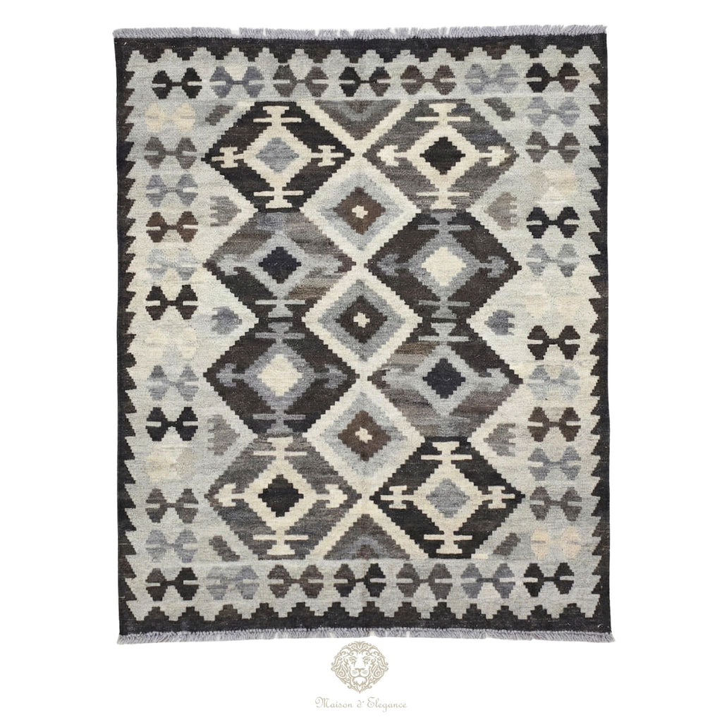 Patterned rug with geometric design on a white background