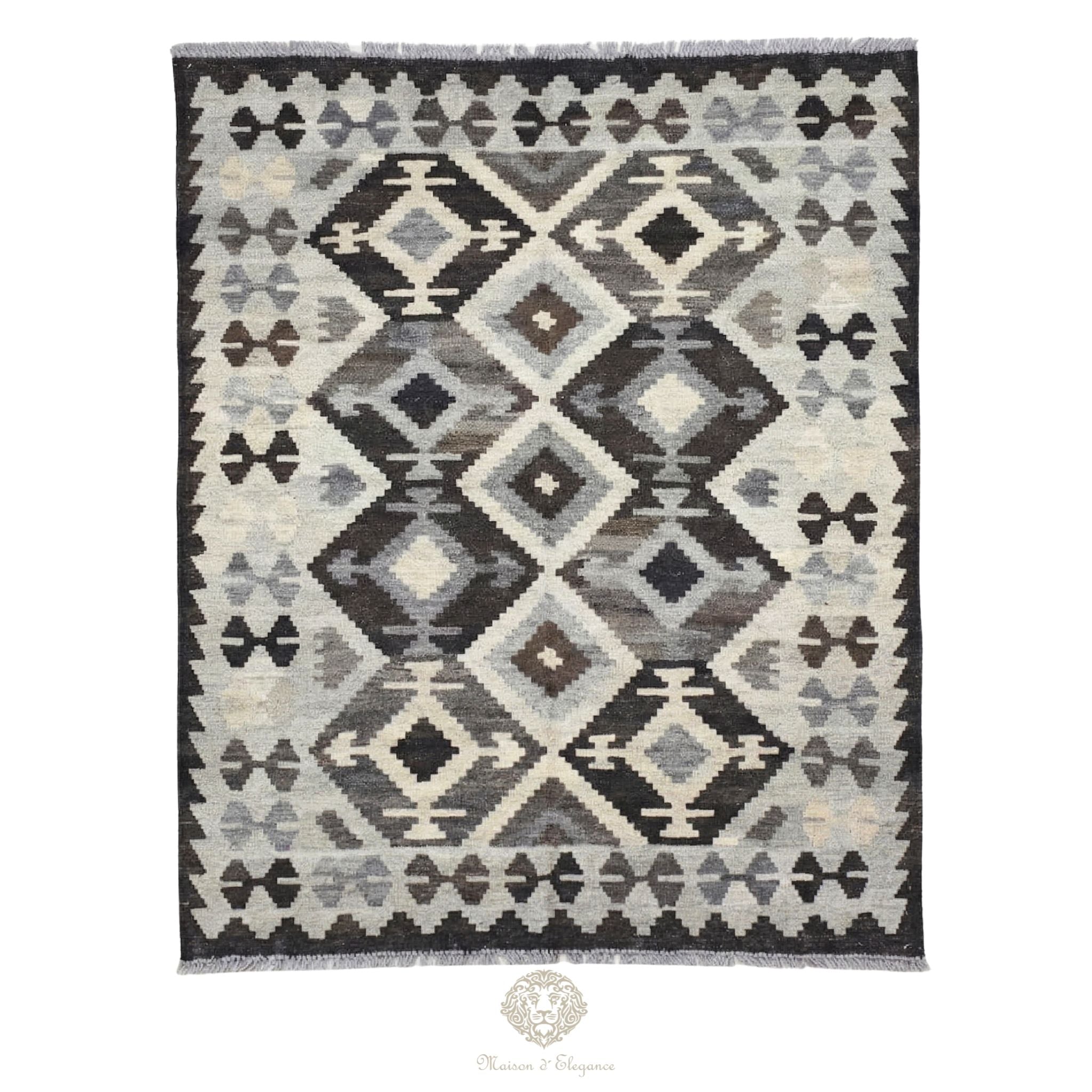 Patterned rug with geometric design on a white background