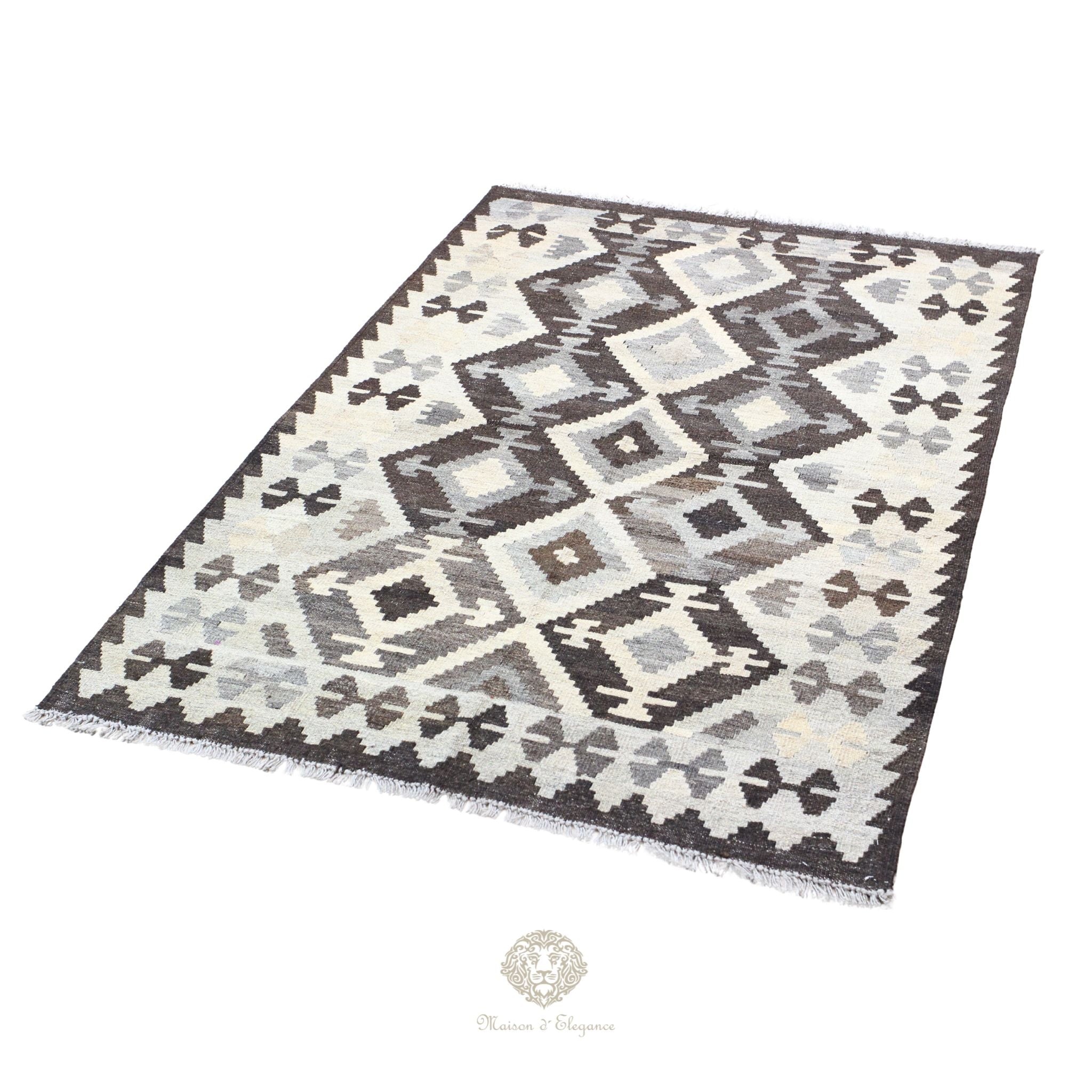 Patterned rug with geometric design on a white background
