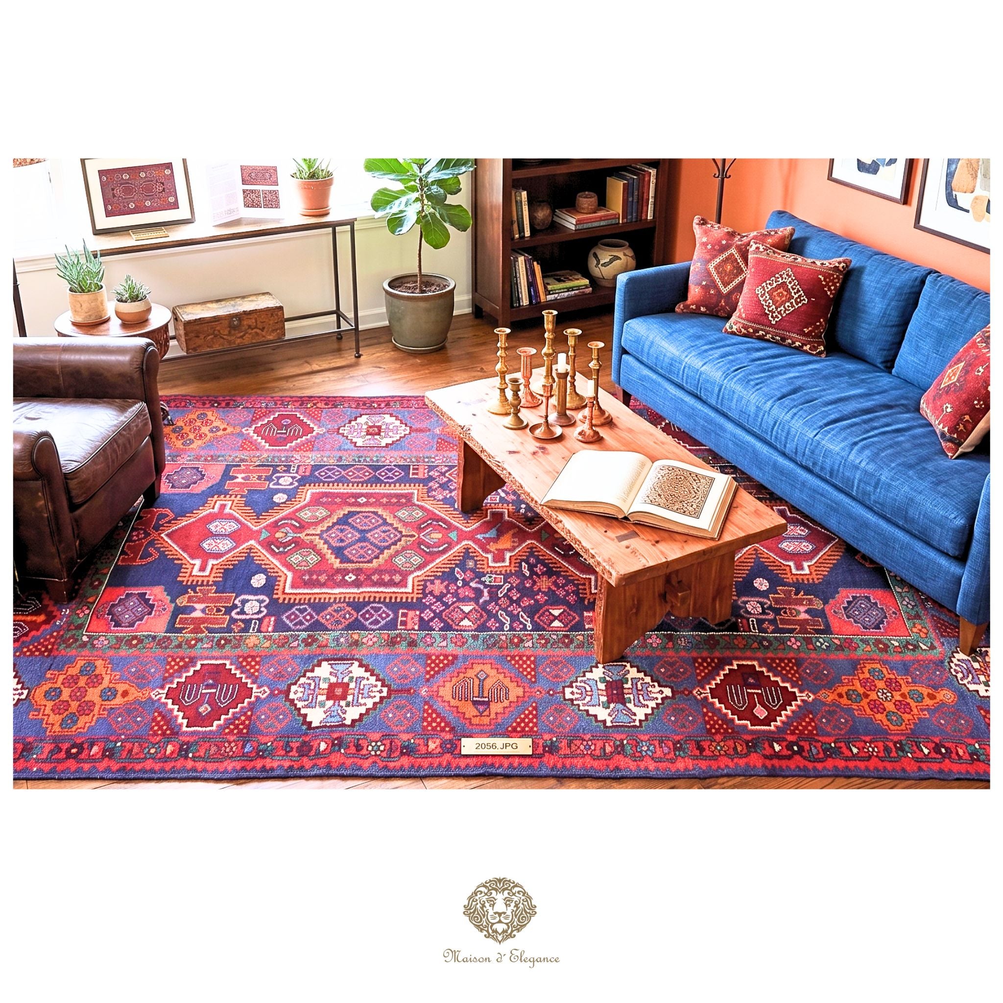 Living room with a colorful patterned rug, blue sofa, and wooden coffee table.