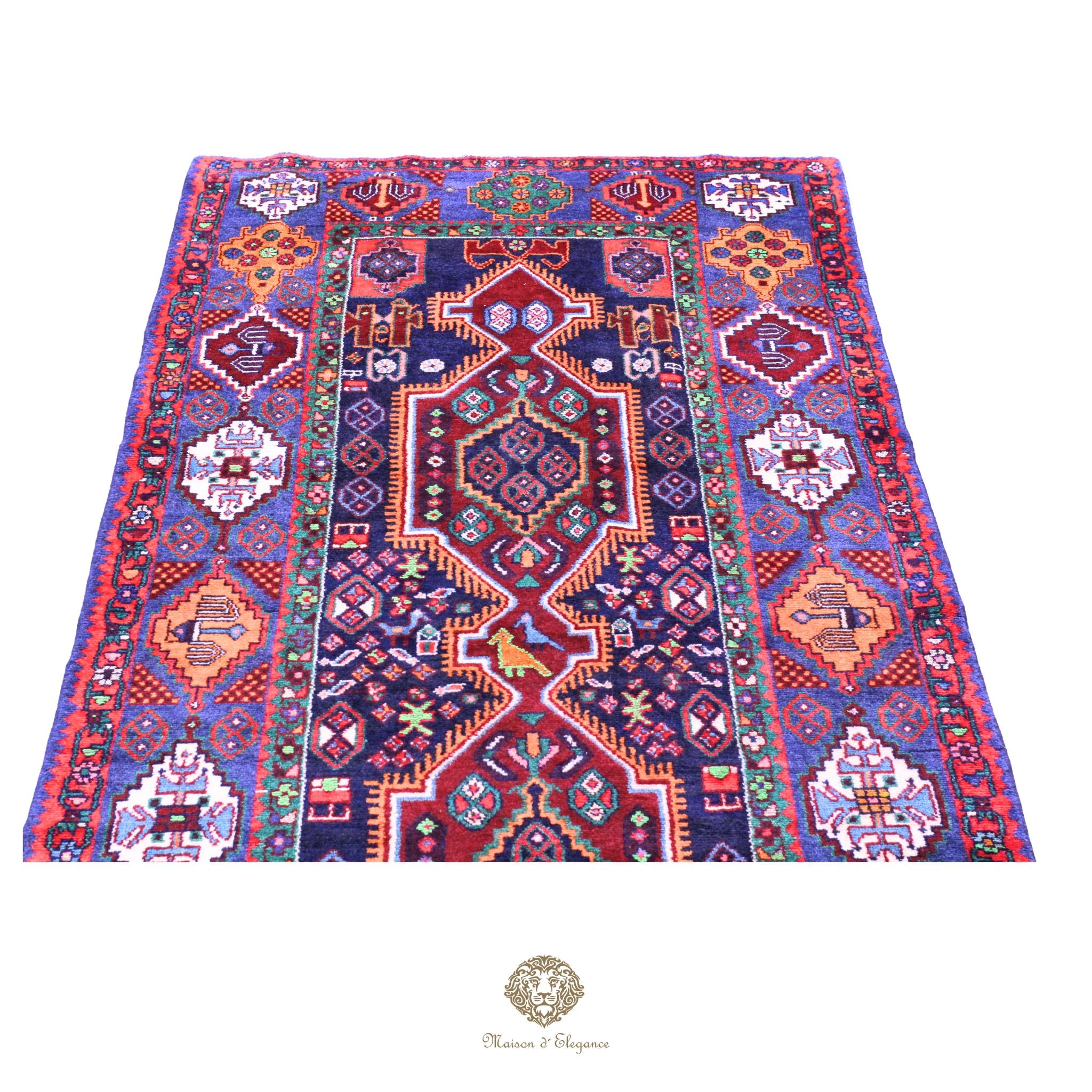 Colorful patterned rug with intricate designs on a navy background