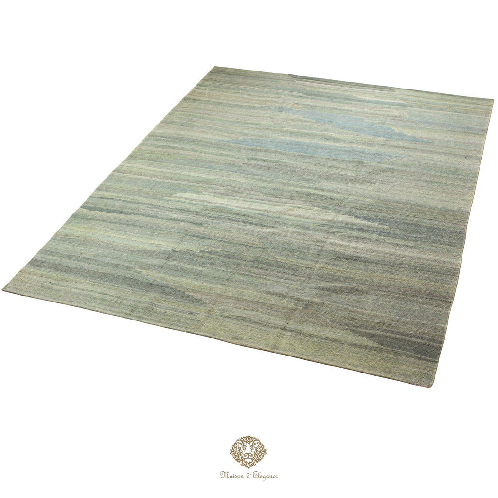 Rectangular rug with a striped pattern on a green background