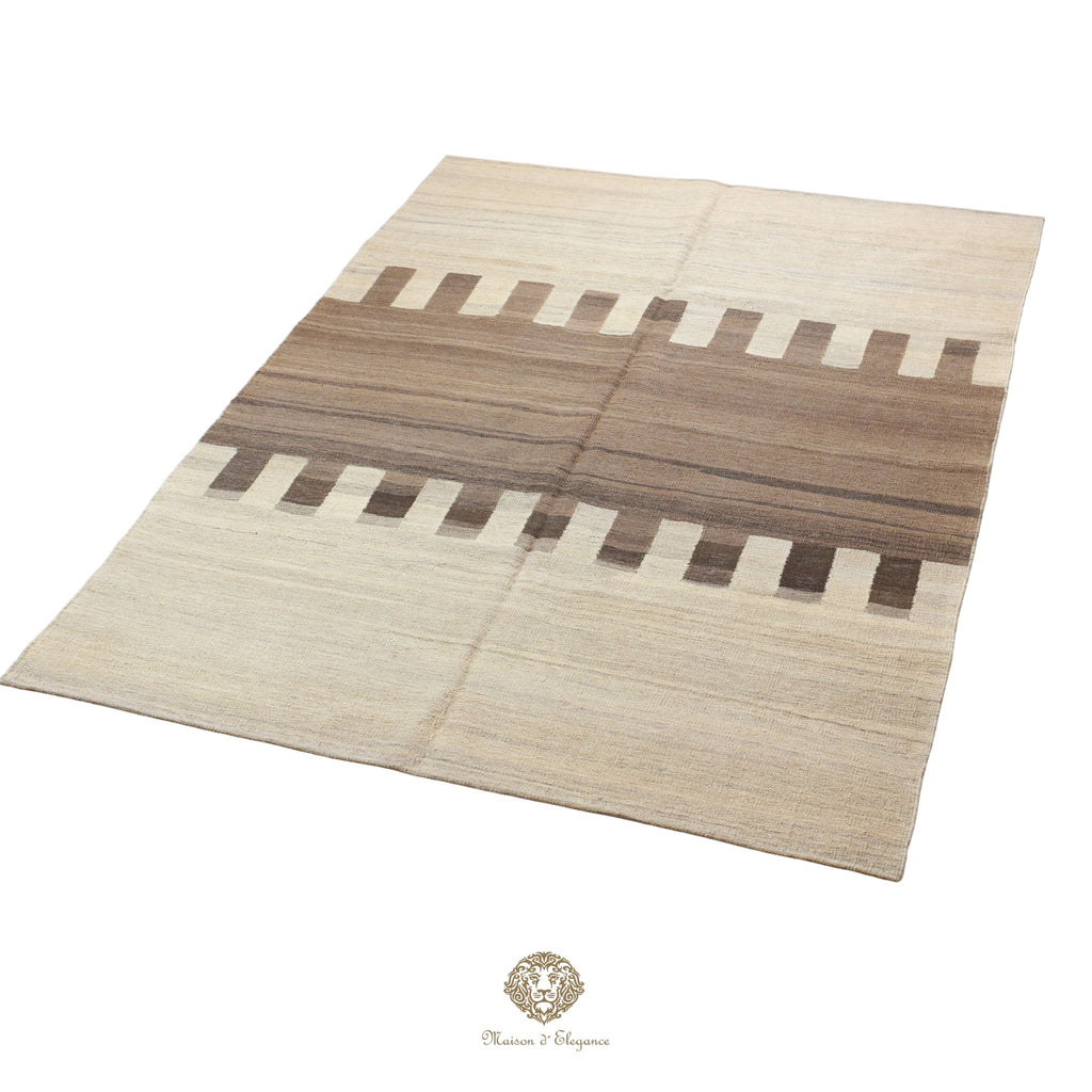 Beige and brown patterned rug on a white background