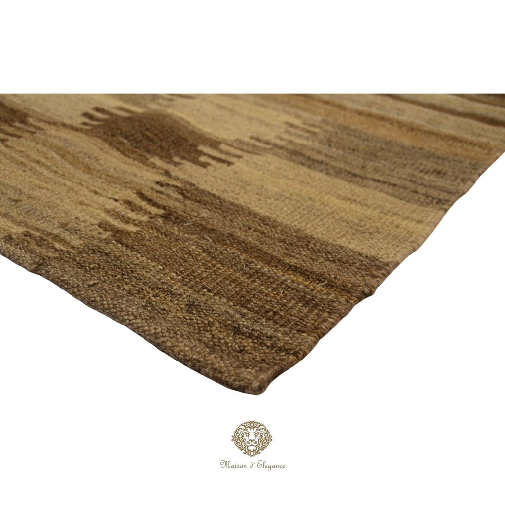 Brown textured rug on a ivory  background with a brand logo at the bottom.