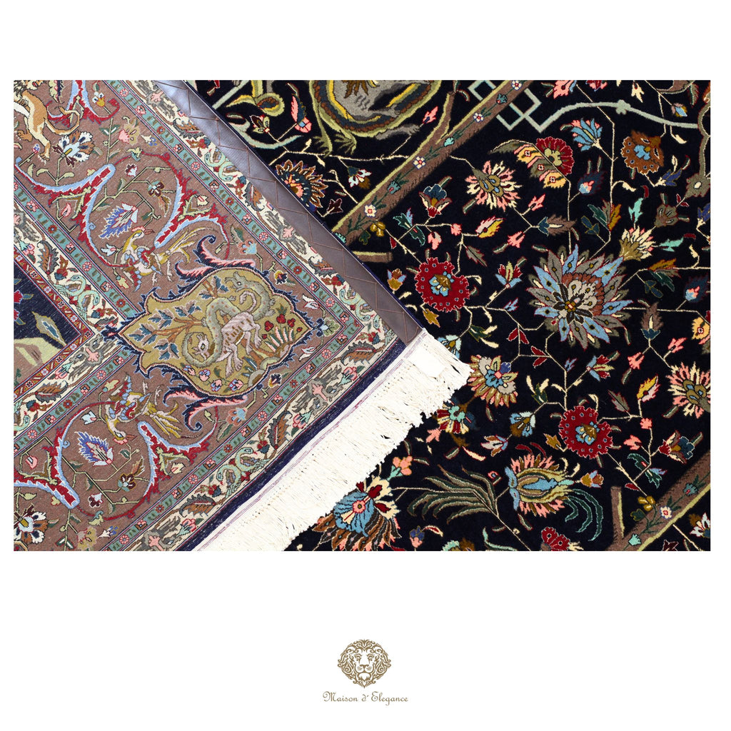 Close-up of two intricately designed rugs with floral patterns on a navy background.