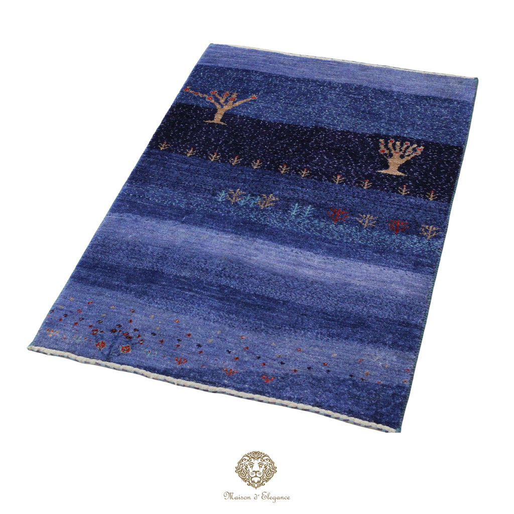 Blue patterned rug with tree designs on a white background